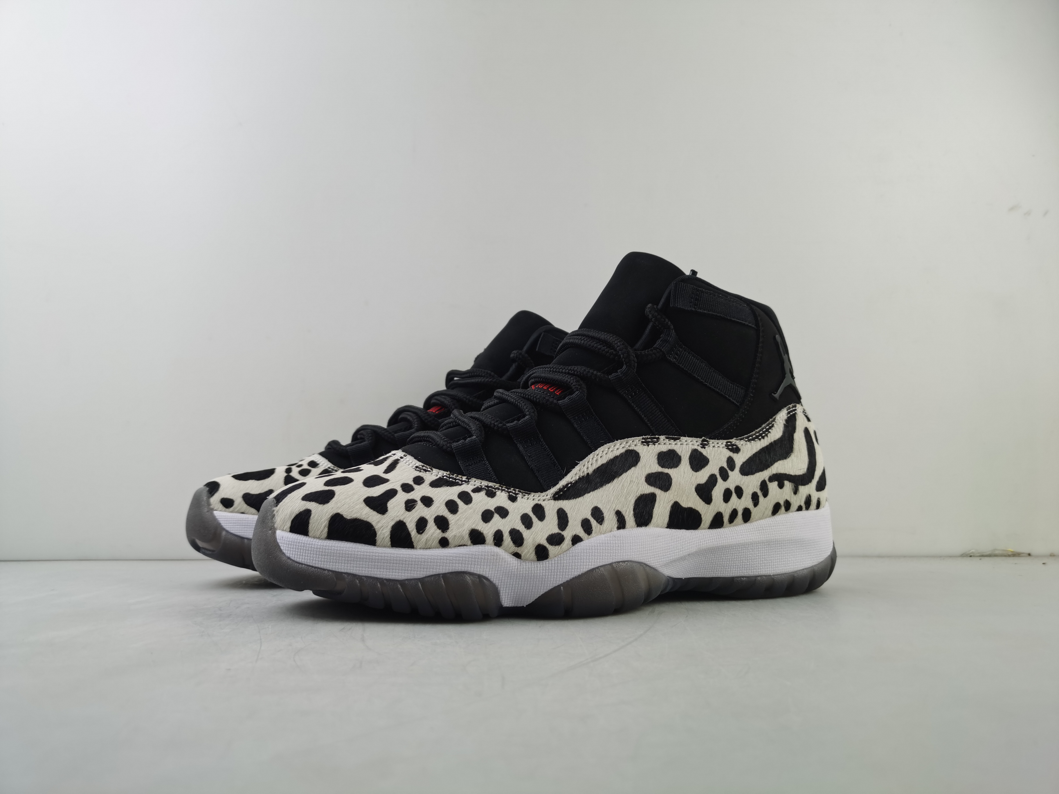Air Jordan 11 “Animal Instinct” Black / Red / Sail / White